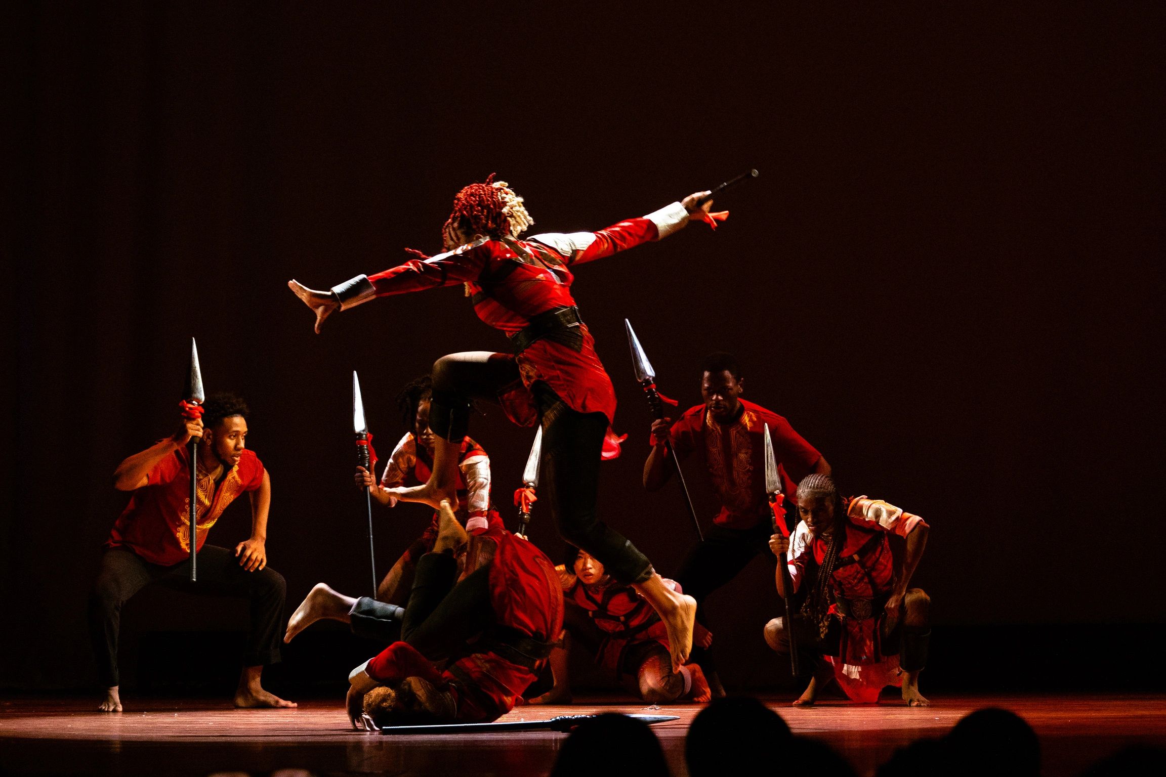 African dance ensemble performers on stage